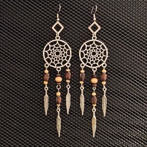Long antique silver dream catcher and wood bead earrings